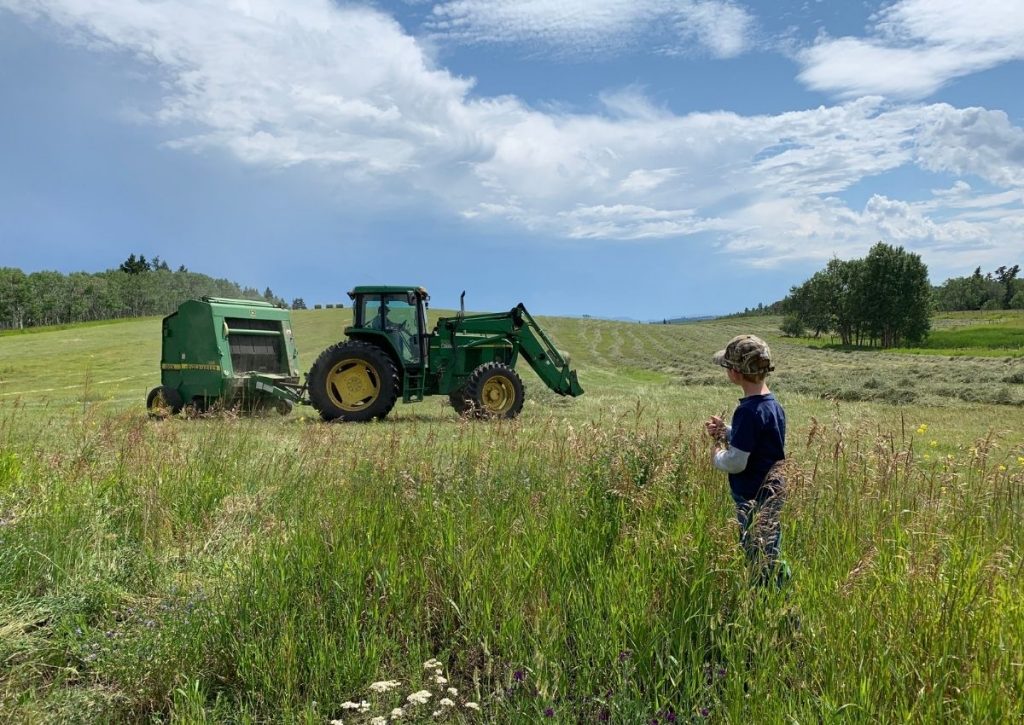 Farm Kid Watching Baling Hay